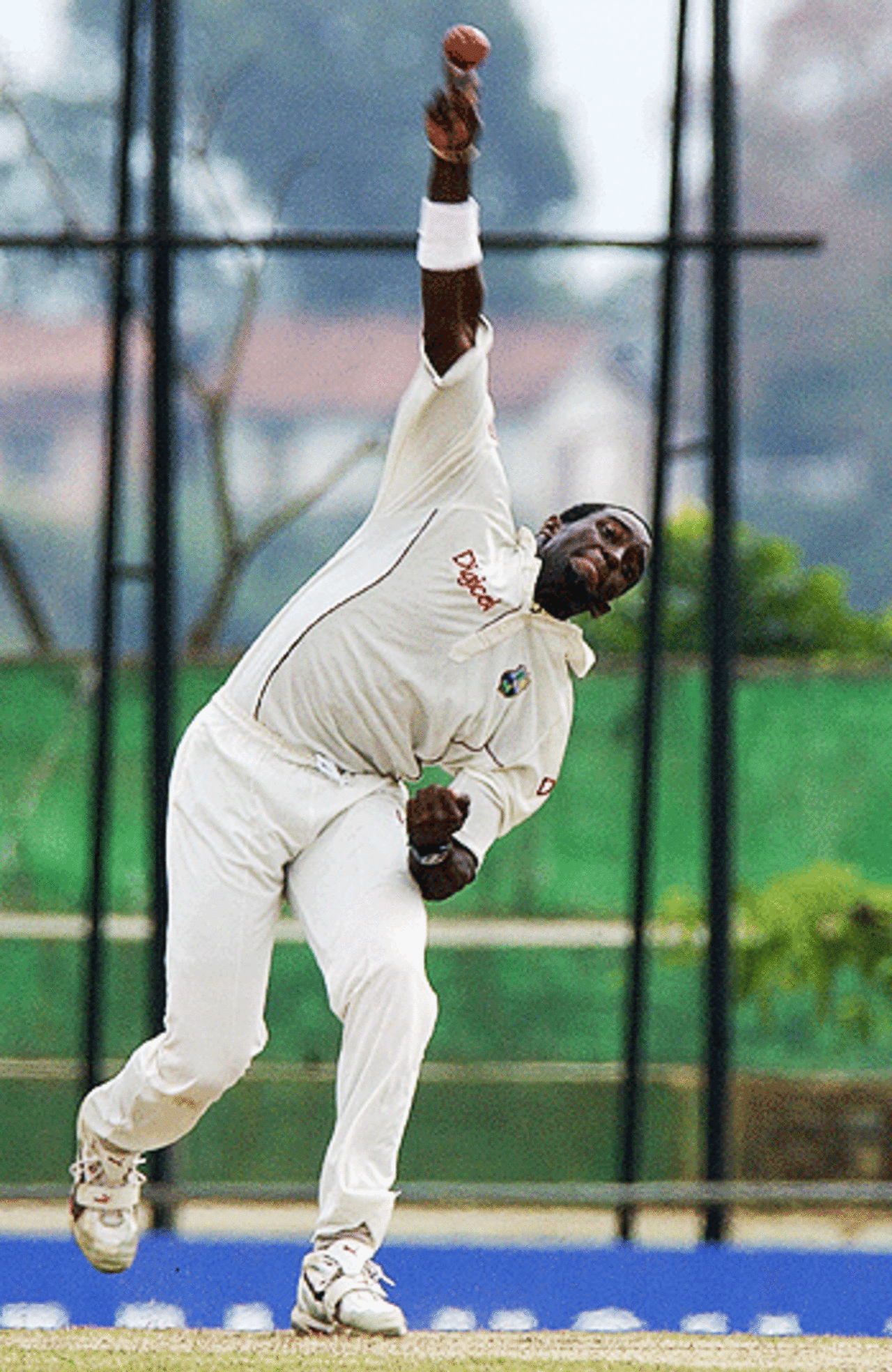 West Indies bowler, Jermaine Lawson delivers the ball during the first day of the second and final test match between Sri Lanka and West Indies at the Asgiriya grounds in Kandy, 22 July 2005