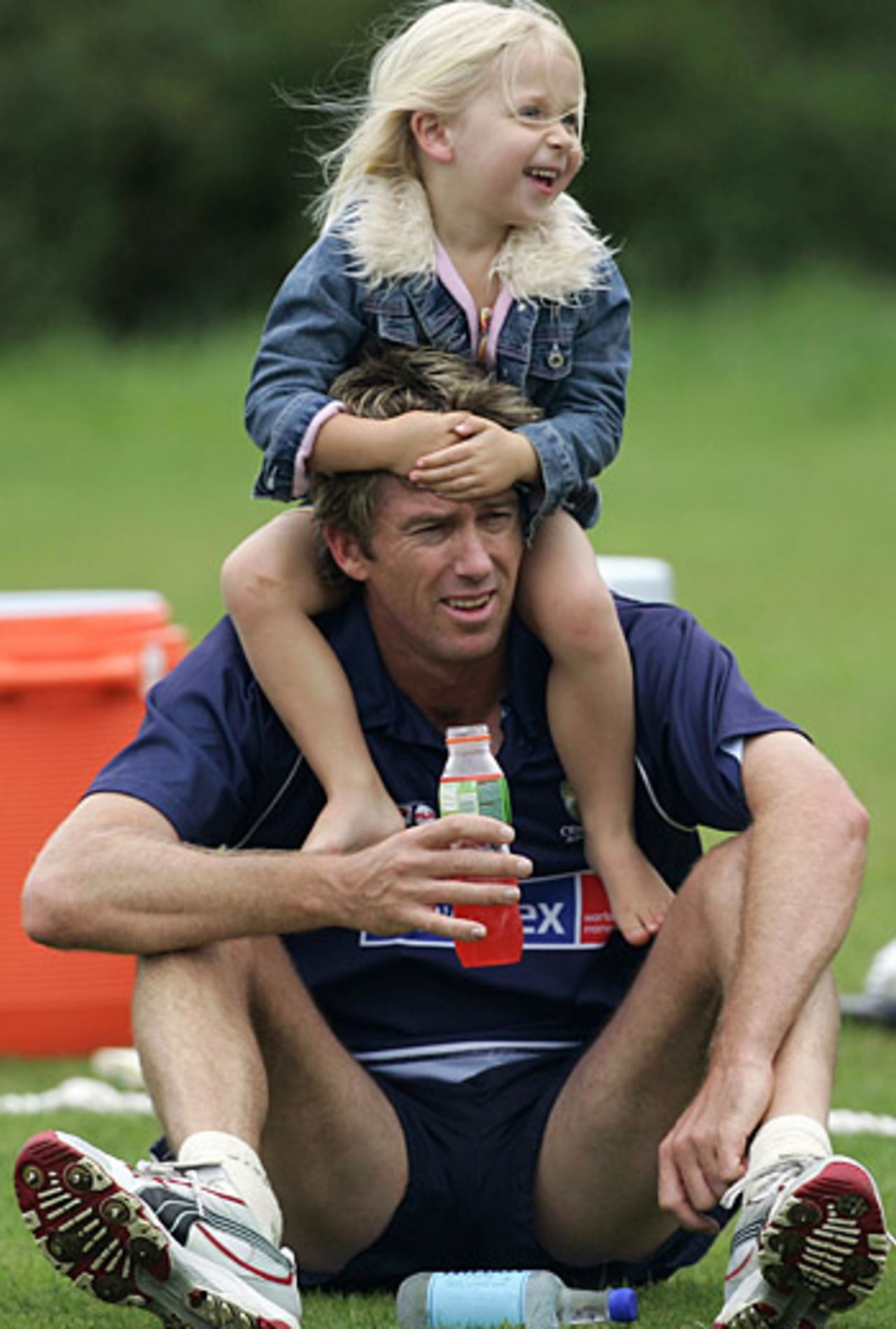 Glenn McGrath with his daughter, Holly, during a practice session, Worcester, July 29, 2005