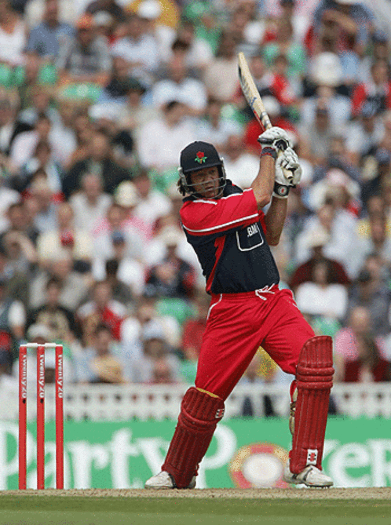 Andrew Symonds powers one through the covers in Twenty20 semi-final match between Surrey and Lancashire at The Oval on July 30, 2005