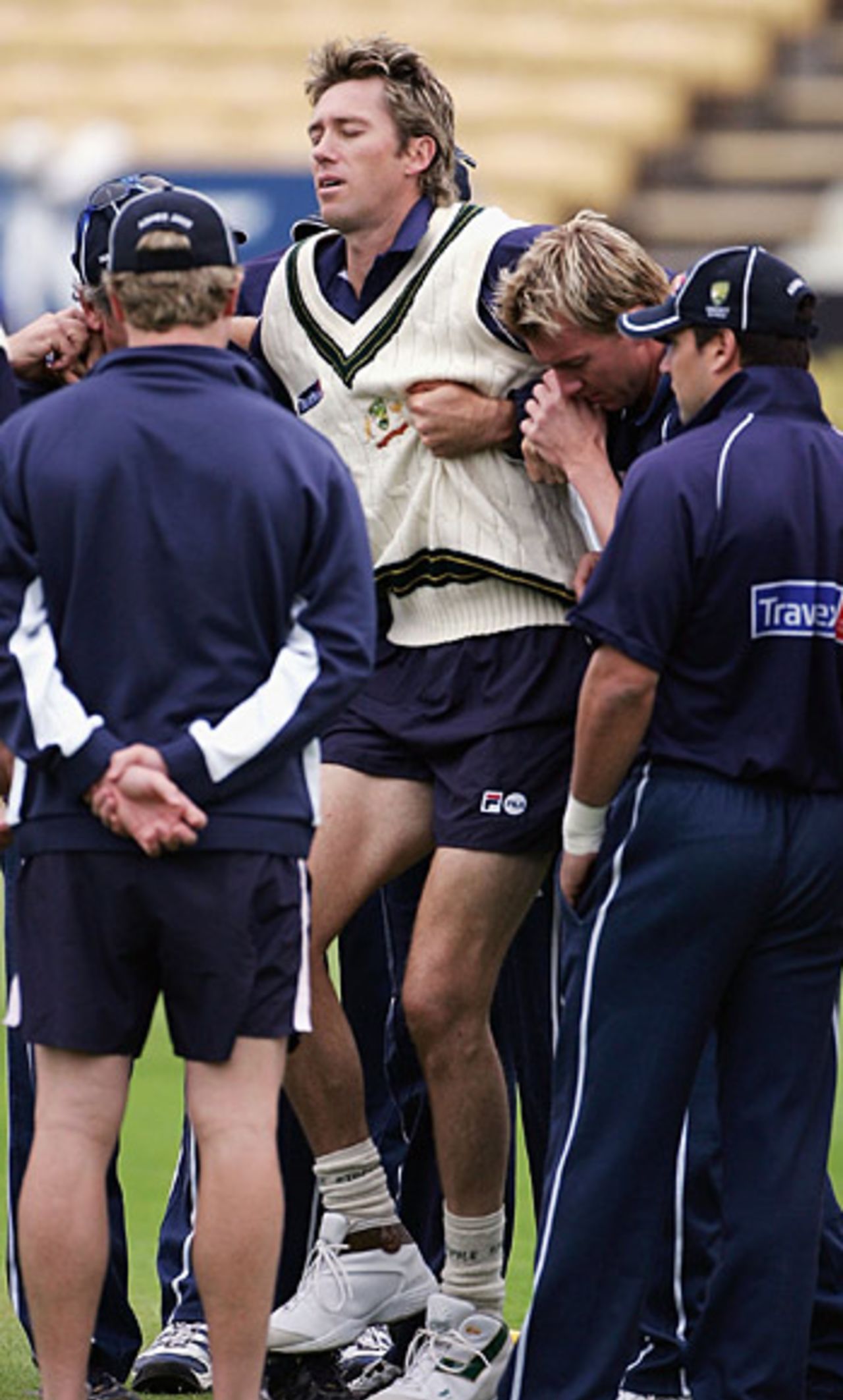Glenn McGrath is surrounded by concerned team mates after injuring his ankle in a warm-up session, England v Australia, Edgbaston, August 4, 2005
