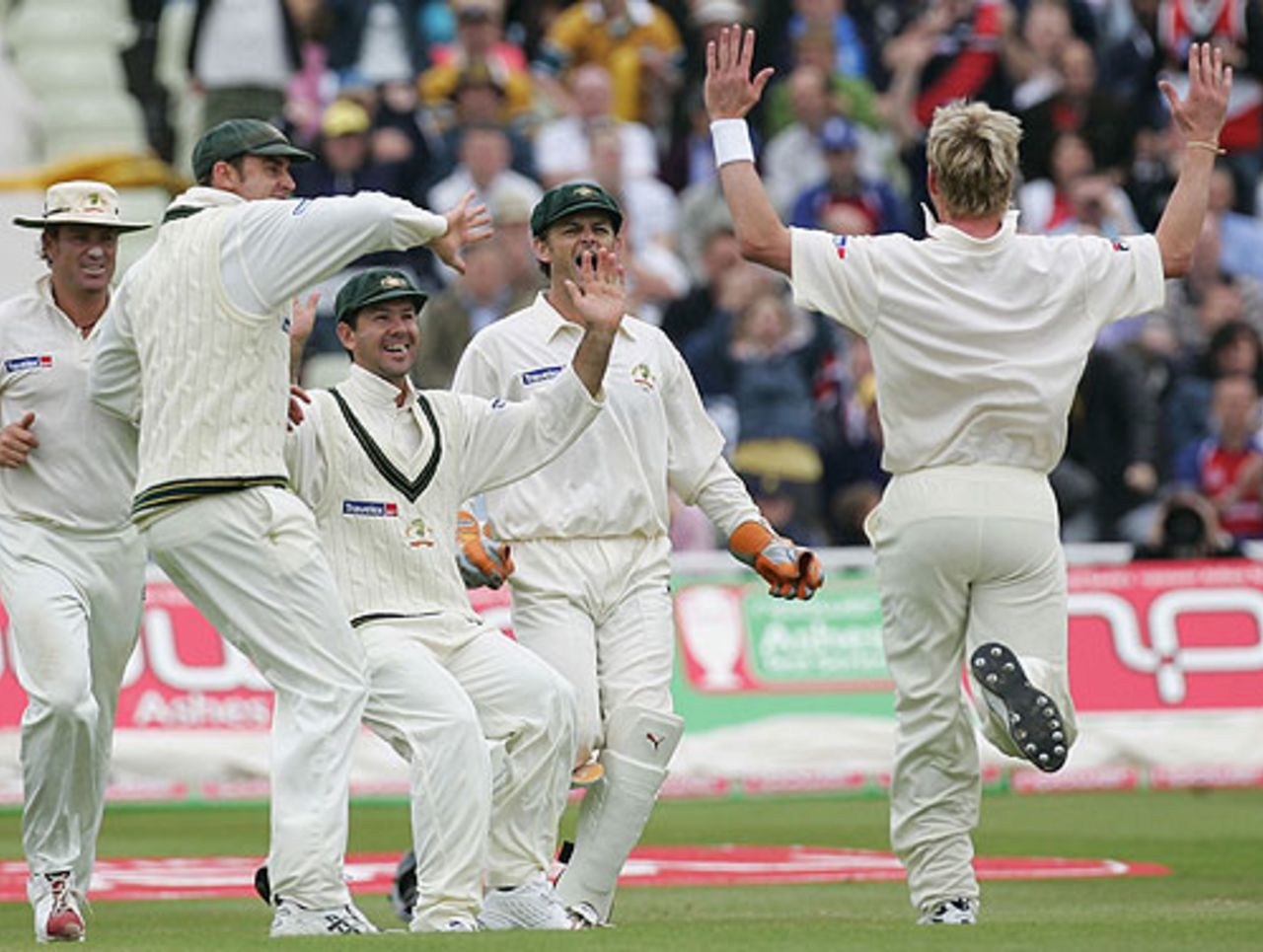 Brett Lee hares towards his team-mates as Michael Vaughan falls, England v Australia, 2nd Test, Edgbaston, August 6