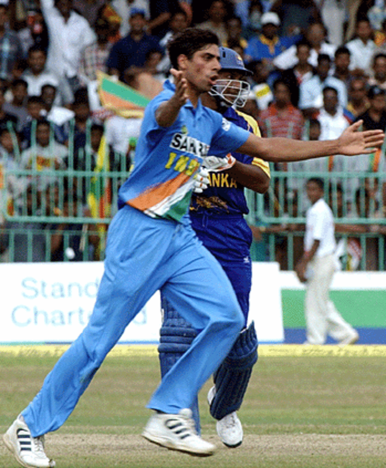 Ashish Nehra celebrates one of his six wickets, India v Sri Lanka, Premadasa Stadium, August 9, 2005