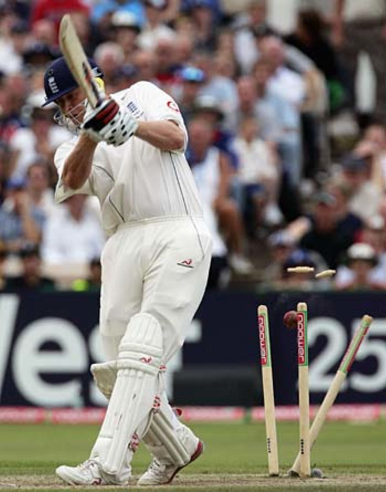 Andrew Flintoff is bowled for 5 by Glenn McGrath during England;s chase for quick runs, England v Australia, 3rd Test, Old Trafford, August 14, 2005
