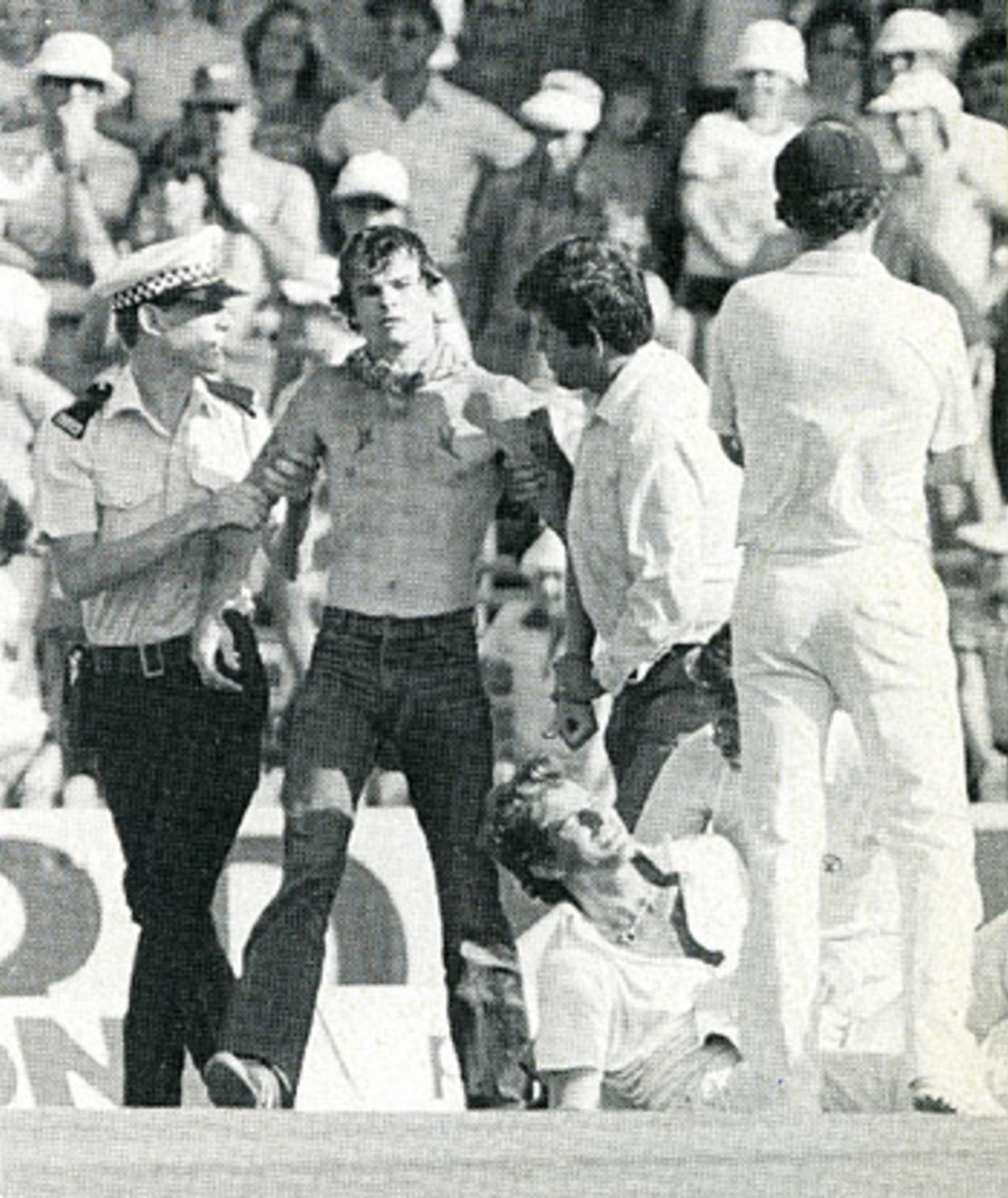 Police deal with the pitch invasion as Terry Alderman lies injured, Australia v England, 1st Test, Perth,November 12, 1982