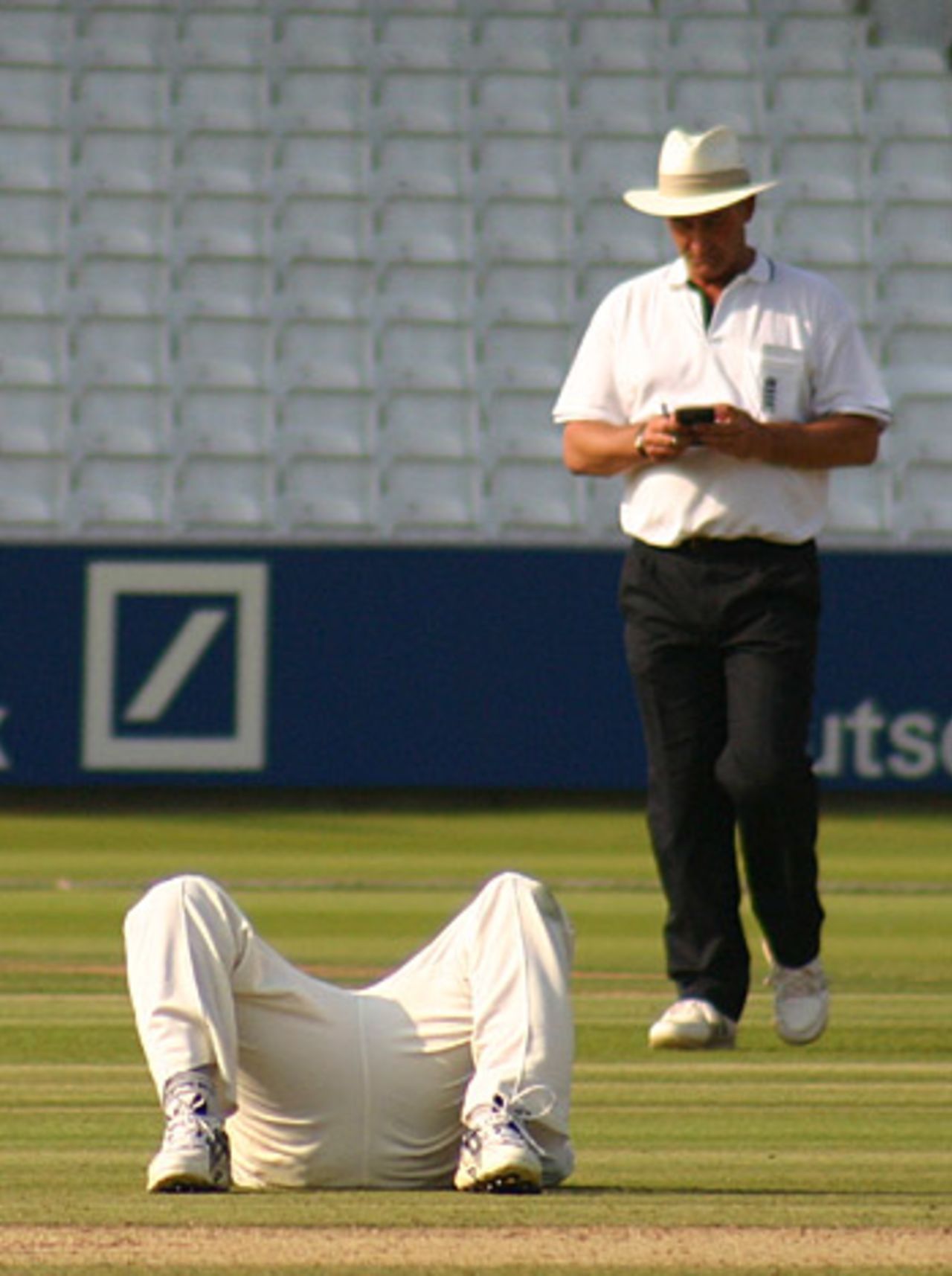 Mushtaq Ahmed prostrate after dropping a caught-and-bowled chance, Middlesex v Sussex, Lord's, August 17, 2005