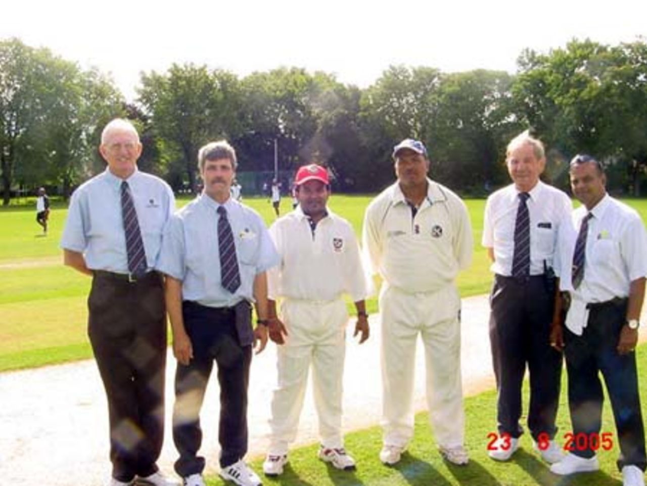 Umpires and Captains at the toss, Canada v Bermuda August 2005, Left to Right Umpires Tony Cooper (Fiji), Trevor Henry (Ireland) Canadian Capt. P. Dassanayake, Bermuda's Capt, C.Smith, Colin Harvey (Match Manger), and Ashook Brijcoomar ( Canada), 3rd Umpire
