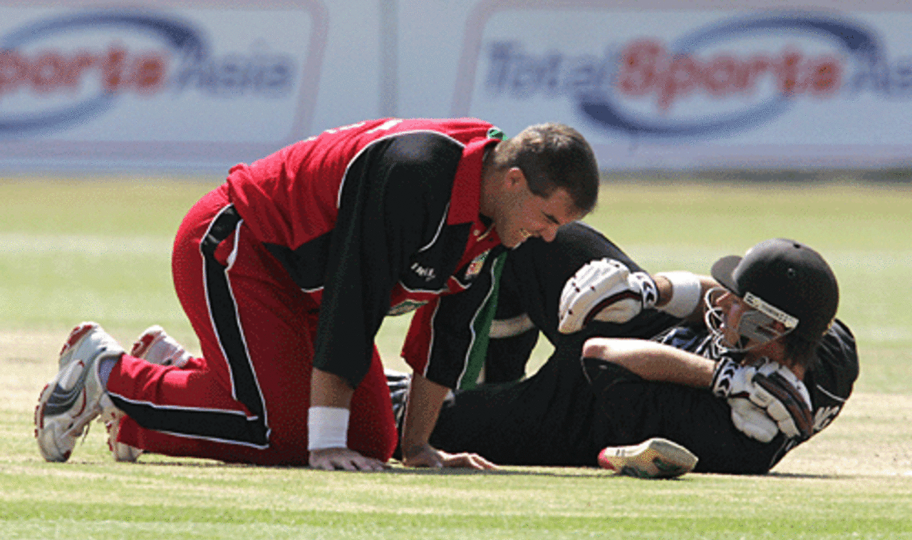 Heath Streak and Stephen Fleming go down after a collision, New Zealand v Zimbabwe, Bulawayo, August 24, 2005