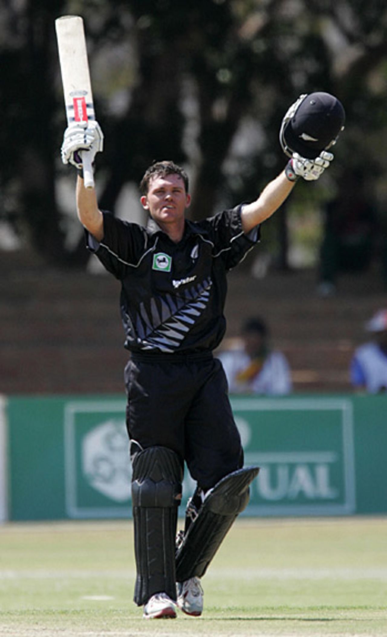 Lou Vincent raises his arms after reaching his hundred. He went on to make 172 from just 120 balls, New Zealand v Zimbabwe, August 24, 2005