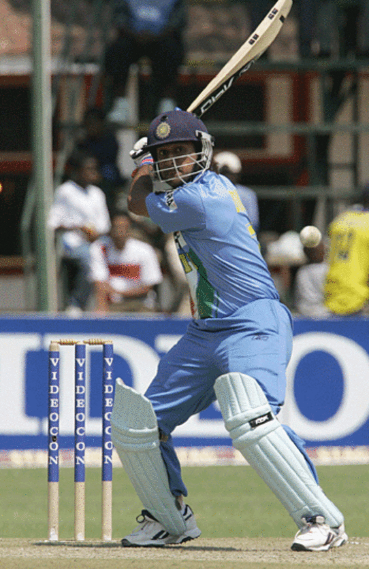 Mahendra Singh Dhoni winds up to smash the ball to the moon, Zimbabwe v India, Harare, August 29, 2005