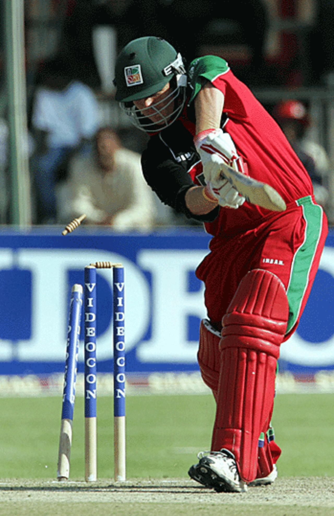 Gavin Ewing has his off stump pegged back by Irfan Pathan, Zimbabwe v India, Harare, August 29, 2005