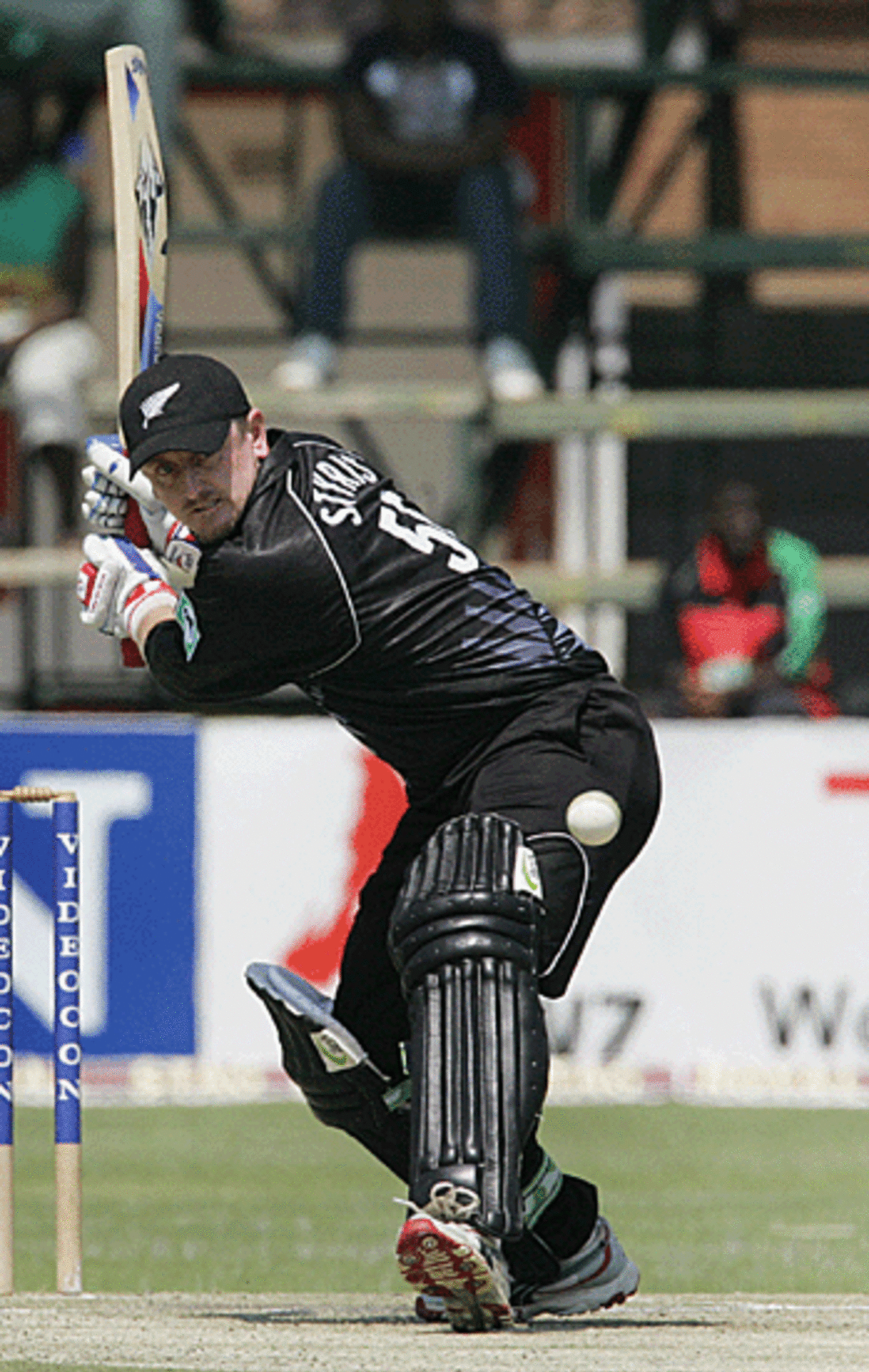 Scott Styris prepares to free his arms during his knock of 63, Zimbabwe v New Zealand, Harare, August 31, 2005
