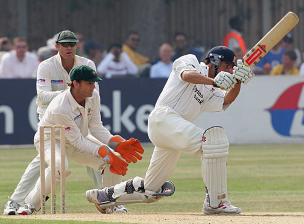 Alastair Cook drives during his brilliant hundred against Australia, watched by Adam Gilchrist and Matthew Hayden, Essex v Australia, September 3, 2005