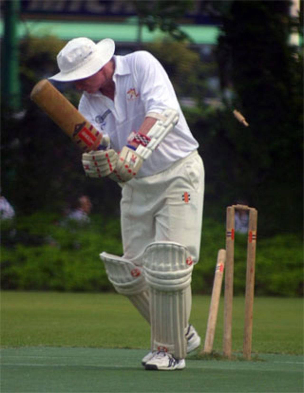 Crusaders' Ray Brewster is bowled during their match against Nomads in the 2003-04 season