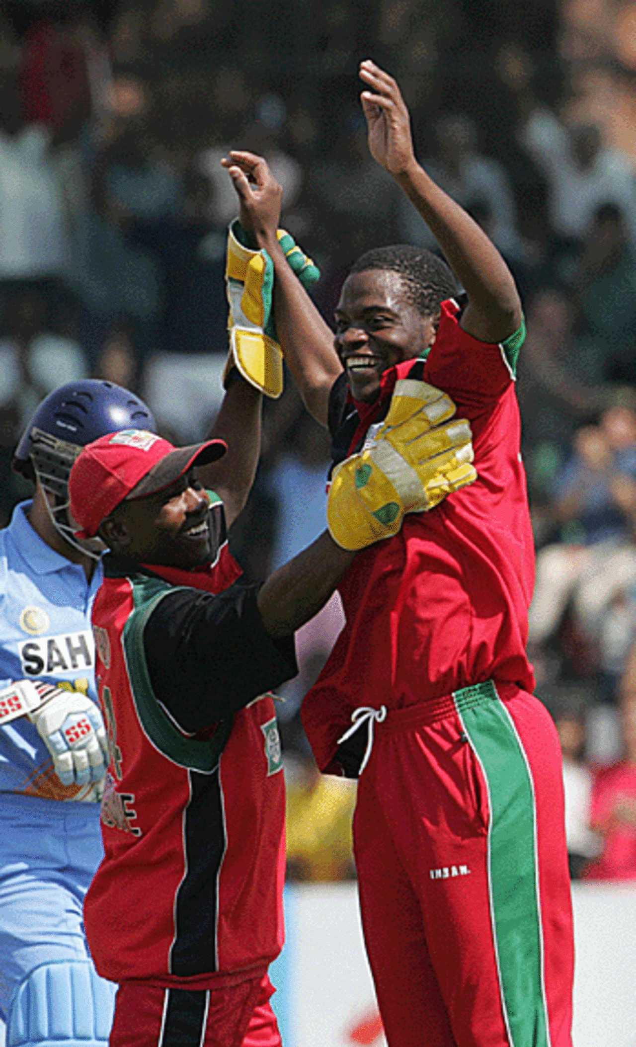Blessing Mahwire and Tatenda Taibu celebrate Virender Sehwag's wicket, Zimbabwe v India, Harare, September 4, 2005