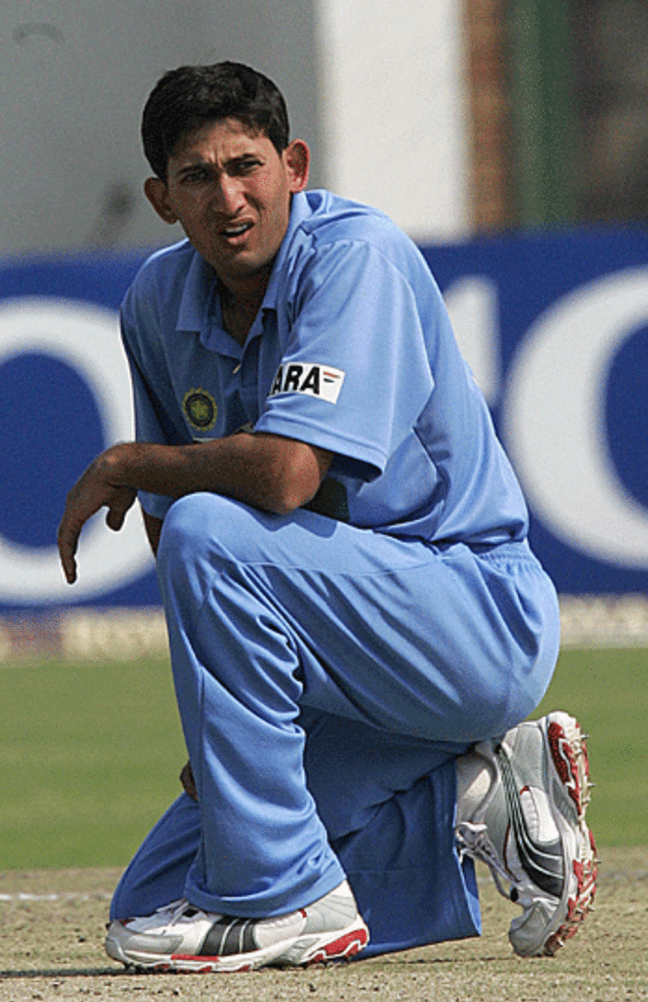 Ajit Agarkar winces as he sees the ball fly to the boundary, India v New Zealand, Harare, September 6, 2005
