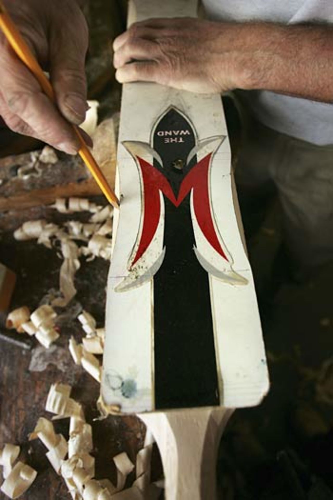  A template is used to mark the distinctive scoops on the Andrew Flintoff signature 'Woodworm Wand' cricket bat , Huntingdon, September 7, 2005 