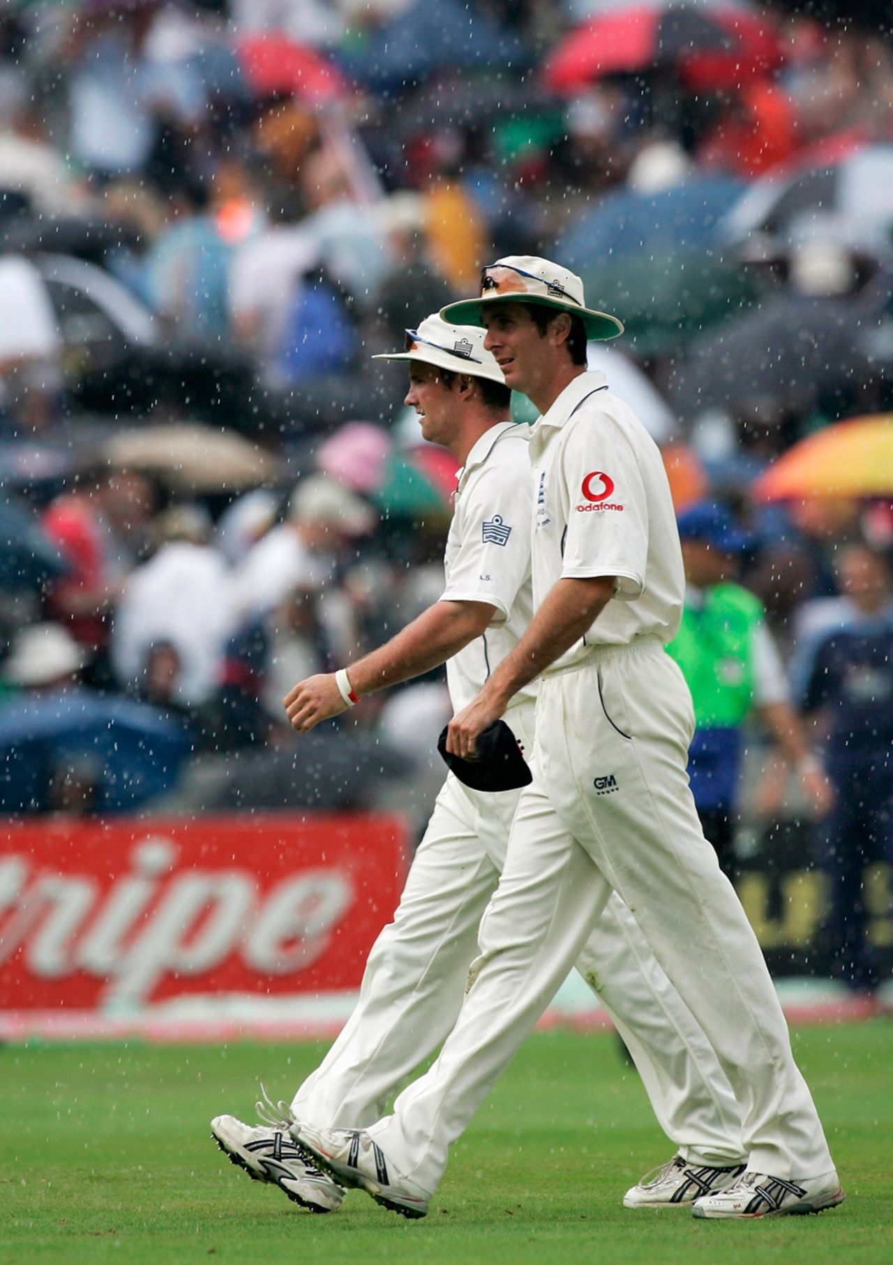 Michael Vaughan and Andrew Strauss troop off as rain interrupts play again, England v Australia, The Oval, London, September 10, 2005