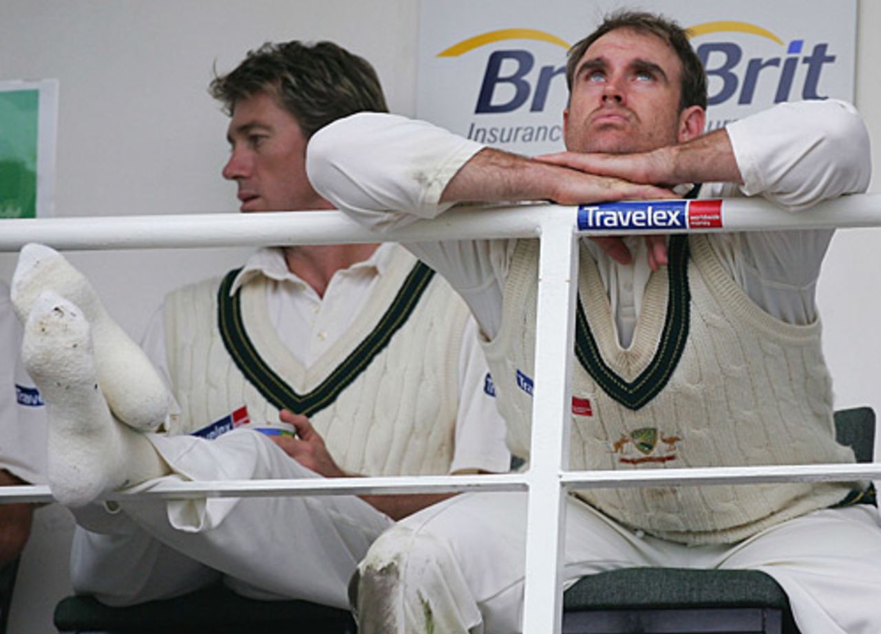 Glenn McGrath (left) and Matthew Hayden look skywards as bad light interrupted play on day four of the final Ashes Test of 2005, England v Australia, The Oval, September 11, 2005