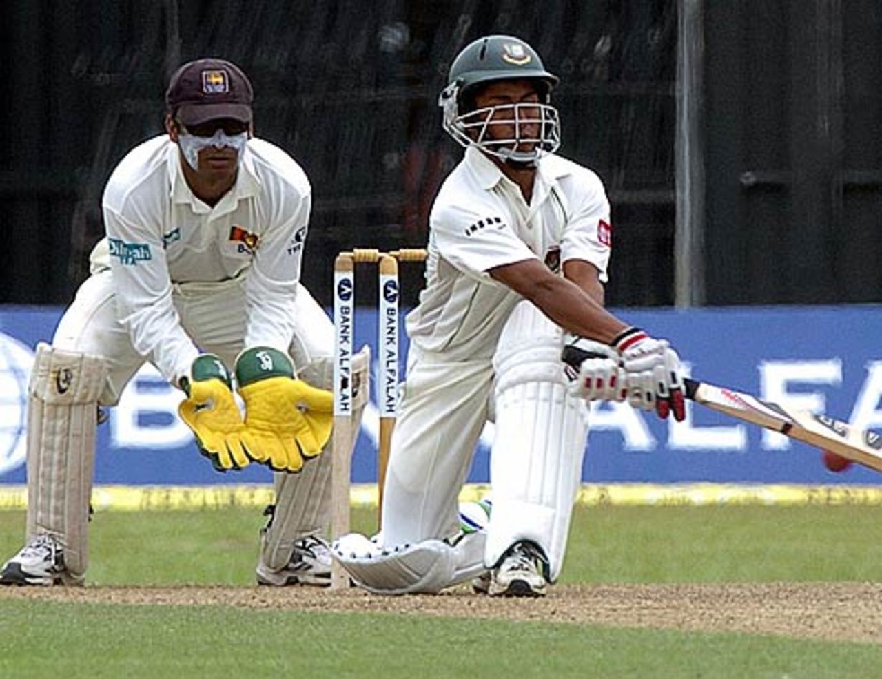 Mohammad Ashraful plays a sweep shot as Kumar Sangakkara looks on, Sri Lanka v Bangladesh, R.Premadasa Stadium, Khettarama, Colombo, September 12, 2005