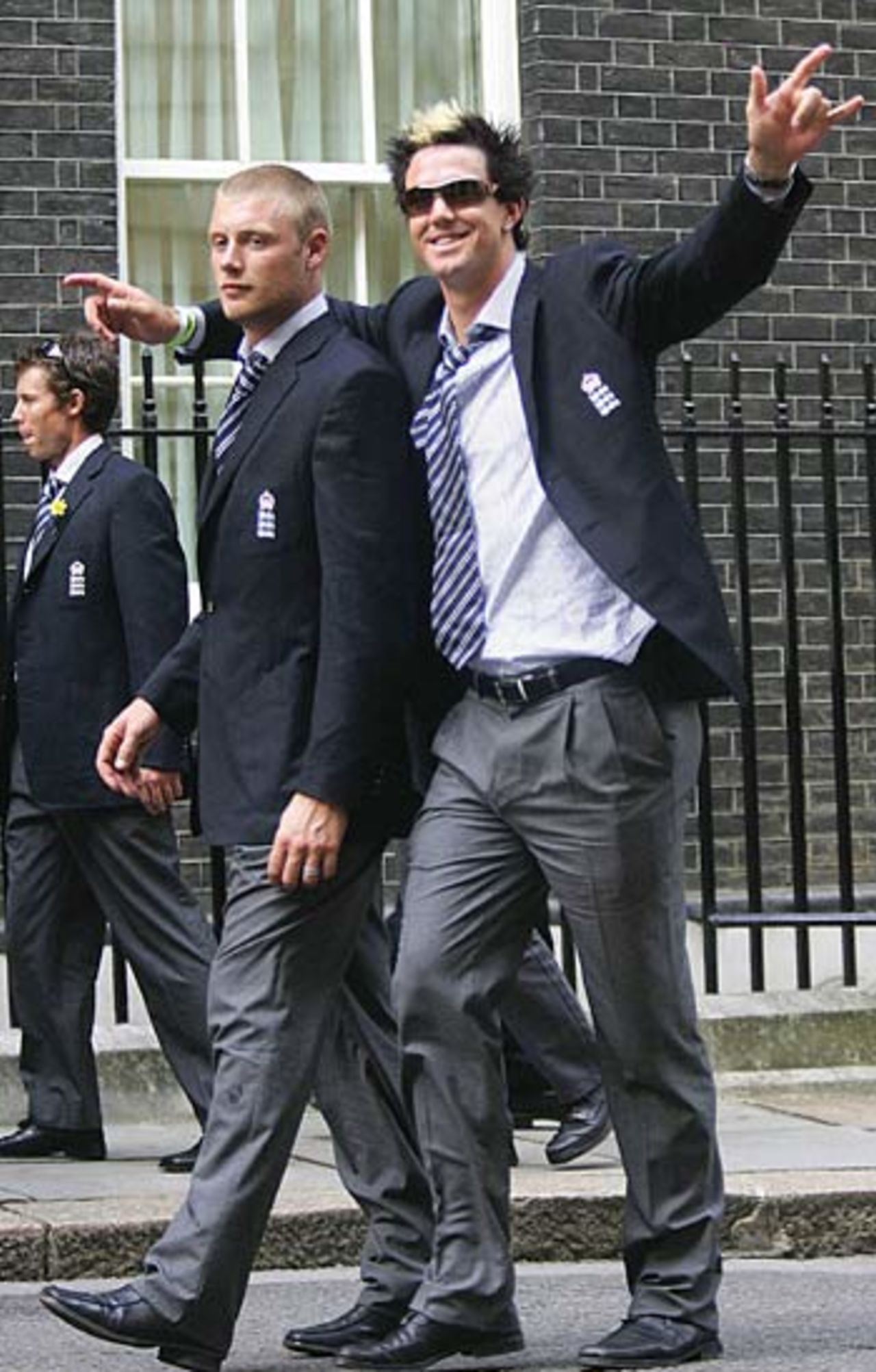 An unsteady Andrew Flintoff heads towards No. 10 Downing Street , helped by Kevin Pietersen, London,  September 13, 2005