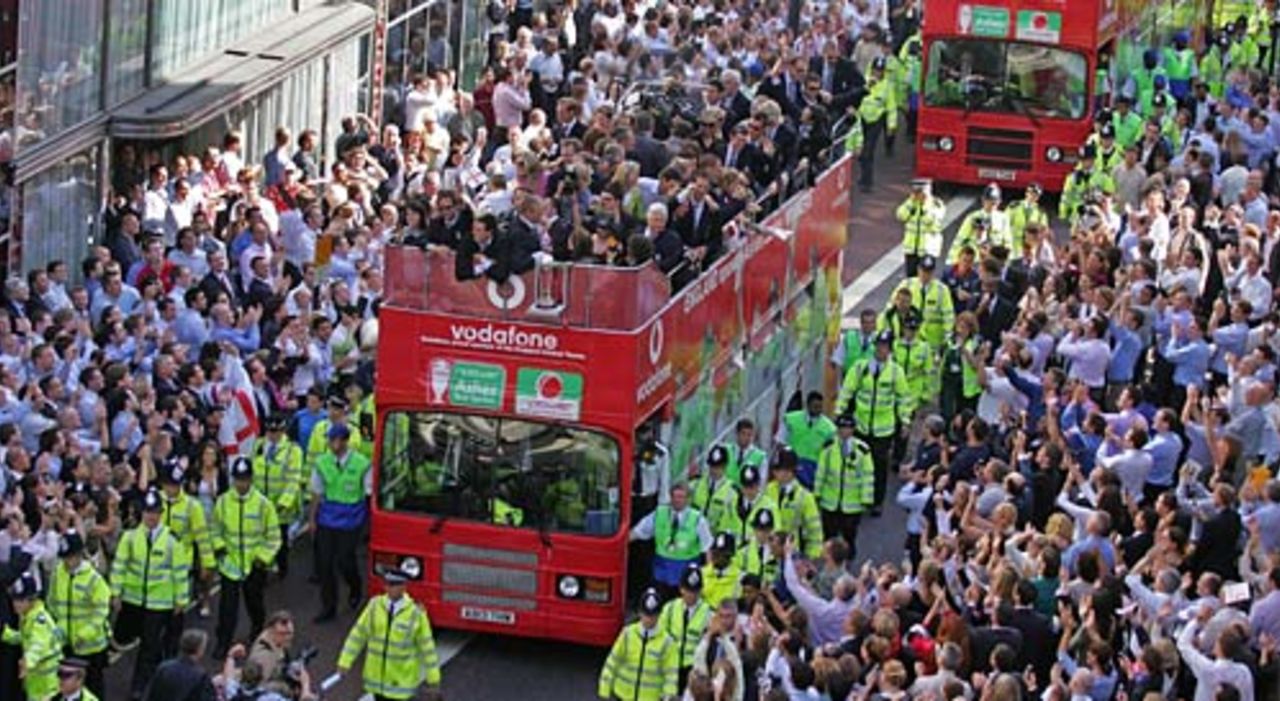 The open-topped bus weaves through the crowds, London,  September 13, 2005