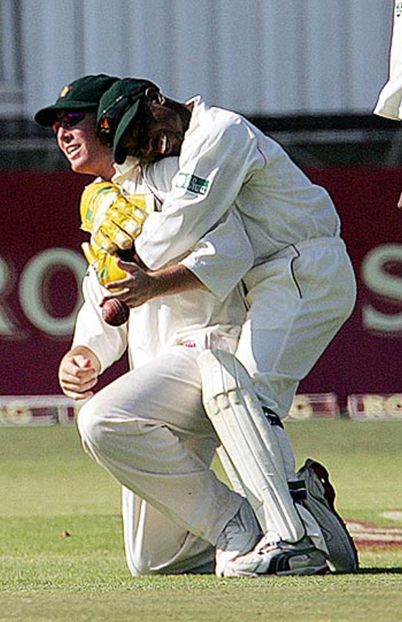 Tatenda Taibu hugs Brendan Taylor after he took a catch to dismiss Rahul Dravid, Zimbabwe v India, September 14, 2005