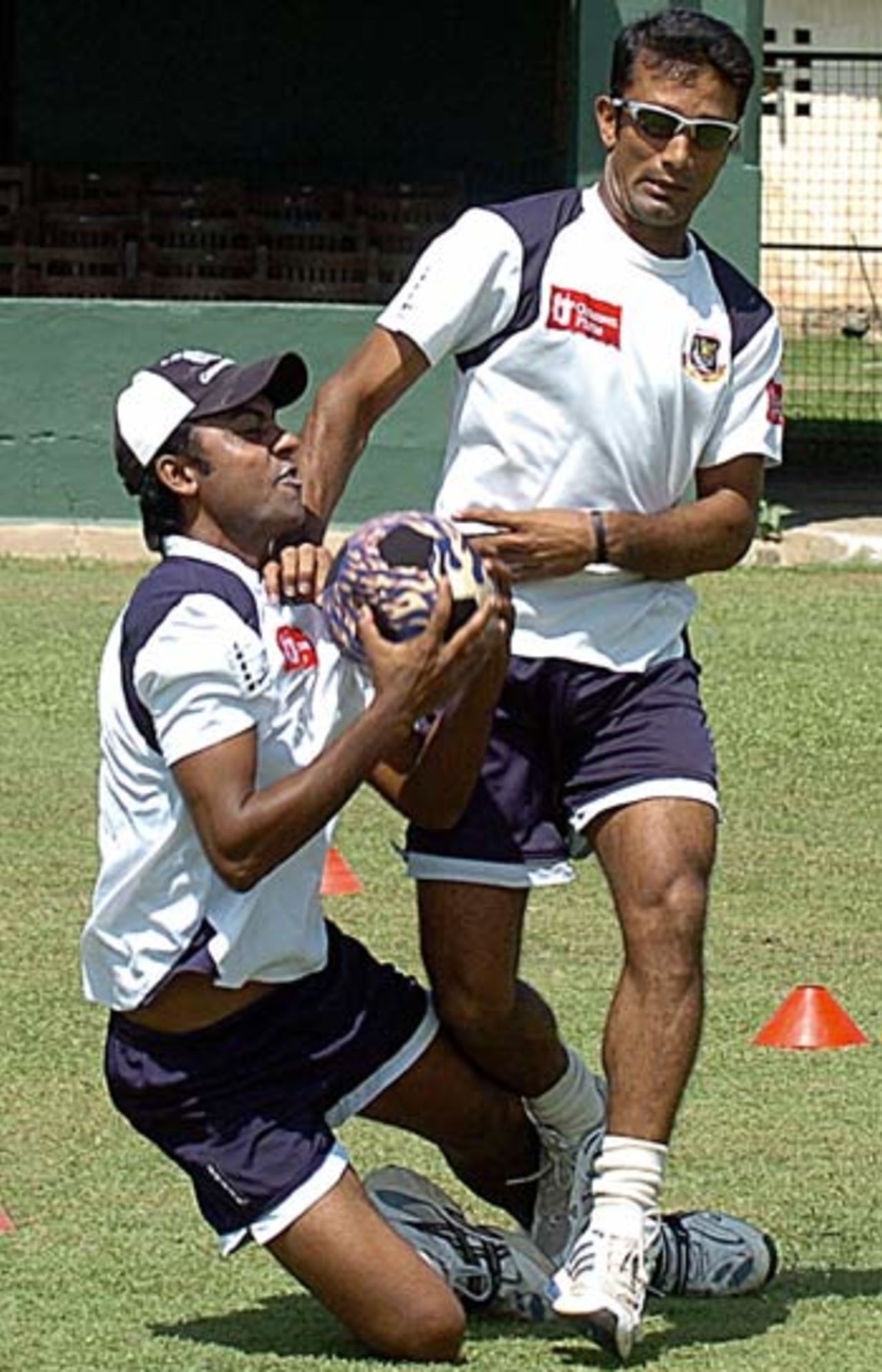 Syed Rasel and Khaled Mashud play football in Colombo, September 19,2005