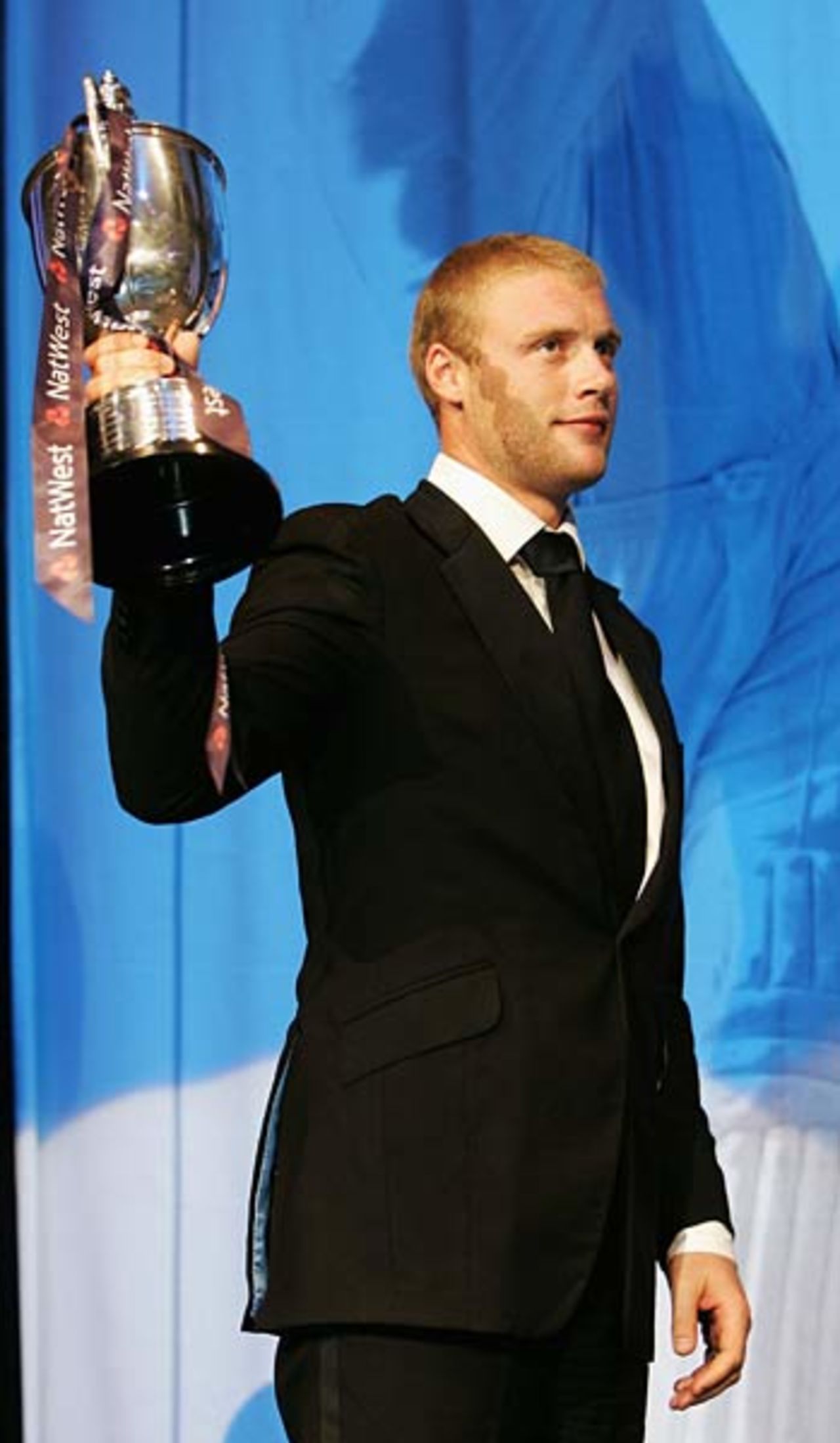 Andrew Flintoff holds up his trophy after being named the PCA Player of the Year at The Royal Albert Hall, London, September 26, 2005