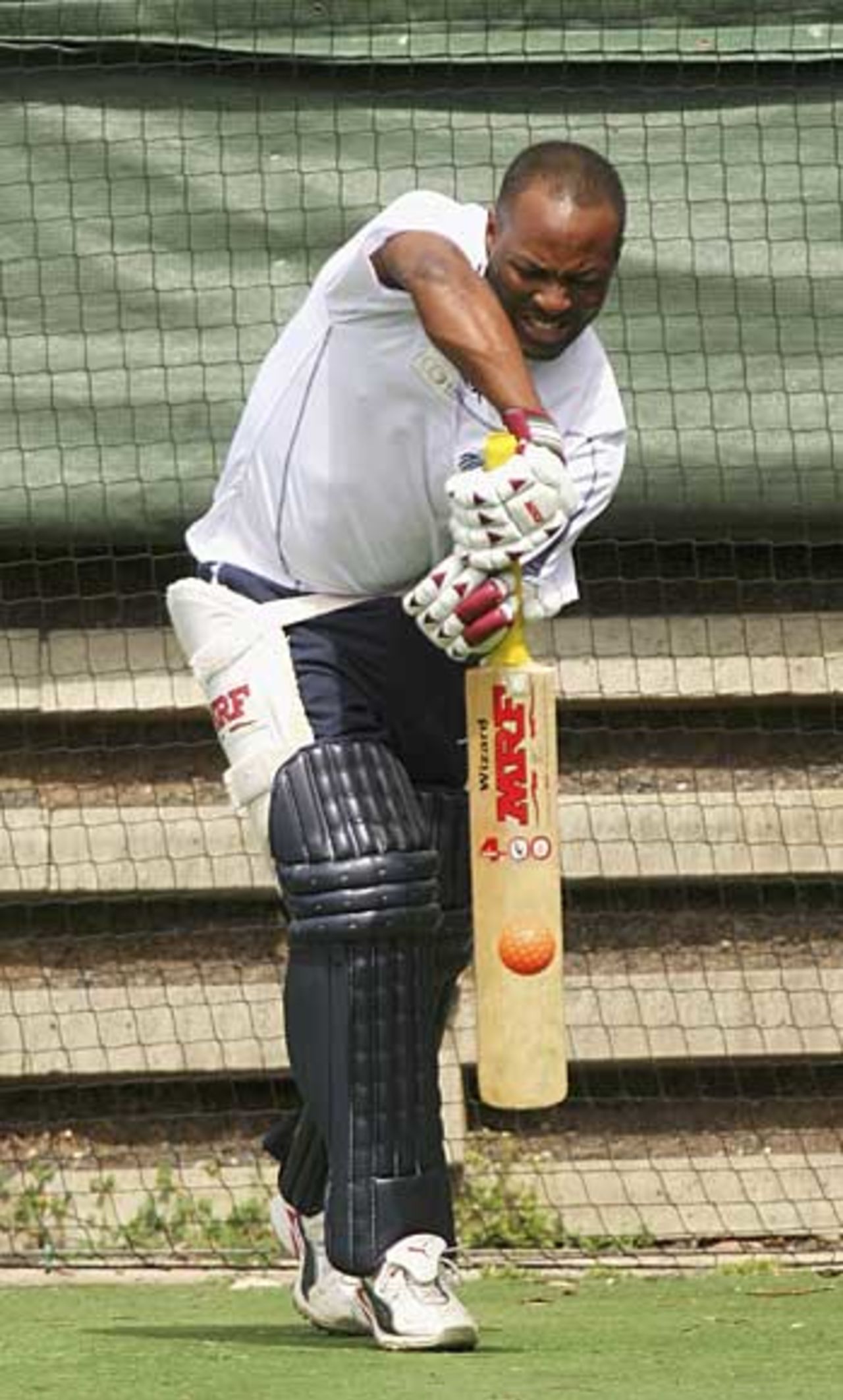 Brian Lara shows off a model forward defence during training at the Junction Oval, Melbourne, September 30, 2005