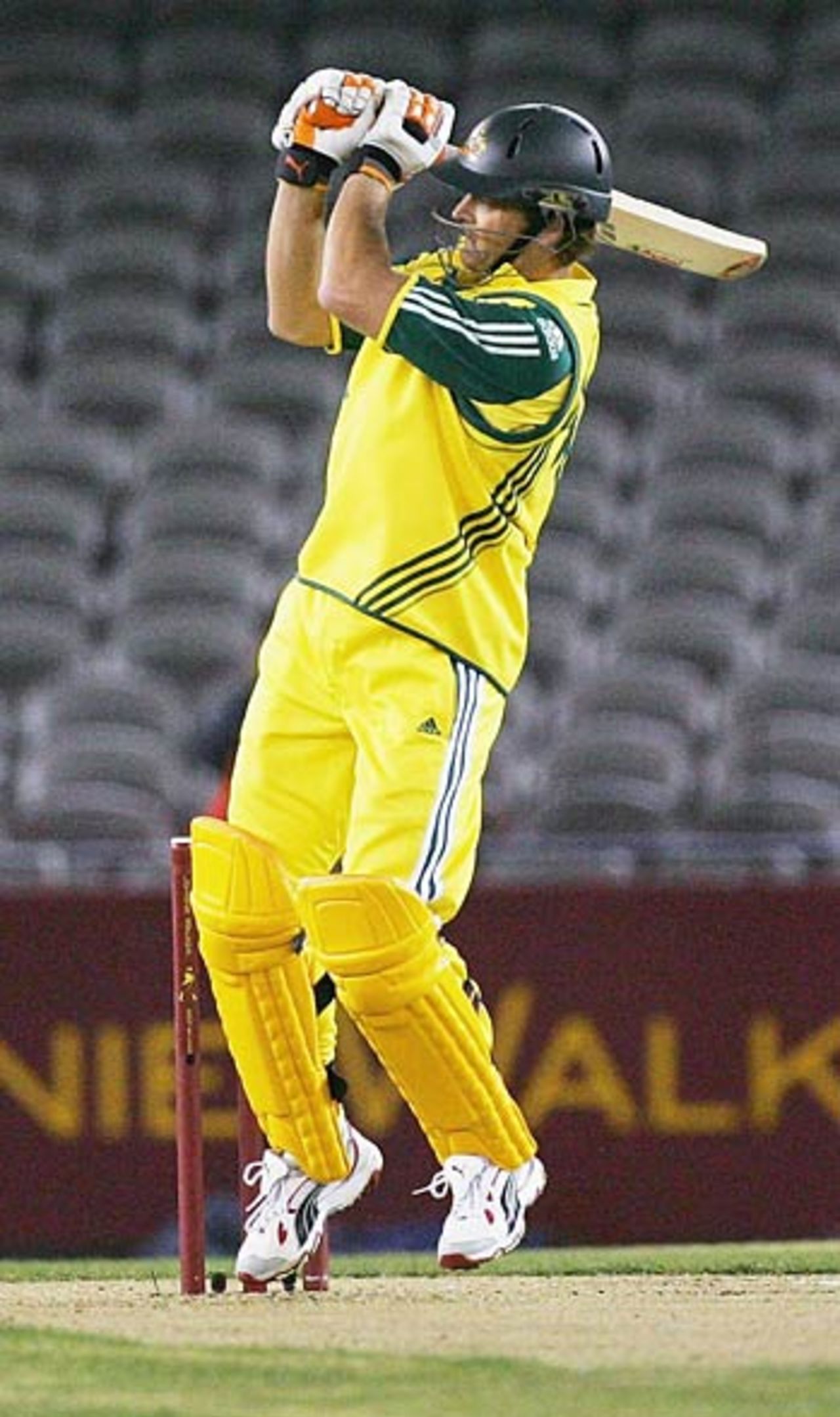 Adam Gilchrist slams Shaun Pollock to the midwicket fence, Australia v World XI, 1st ODI, ICC Super Series, Telstra Dome, Melbourne, October 5, 2005
