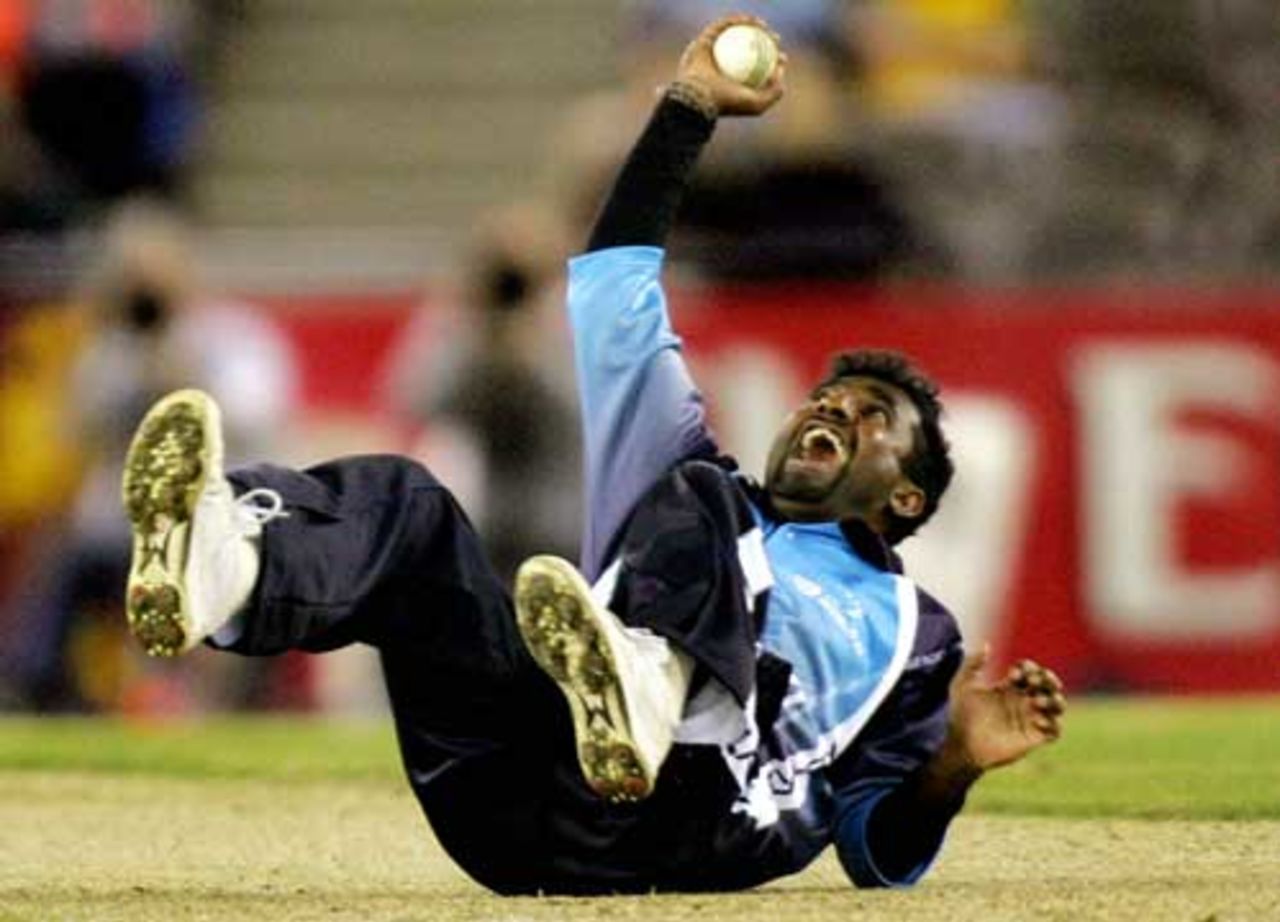 Muttiah Muralitharan takes an excellent catch off his own bowling to dismiss Simon Katich, Australia v World XI, 1st ODI, ICC Super Series, Telstra Dome, Melbourne, October 5, 2005
