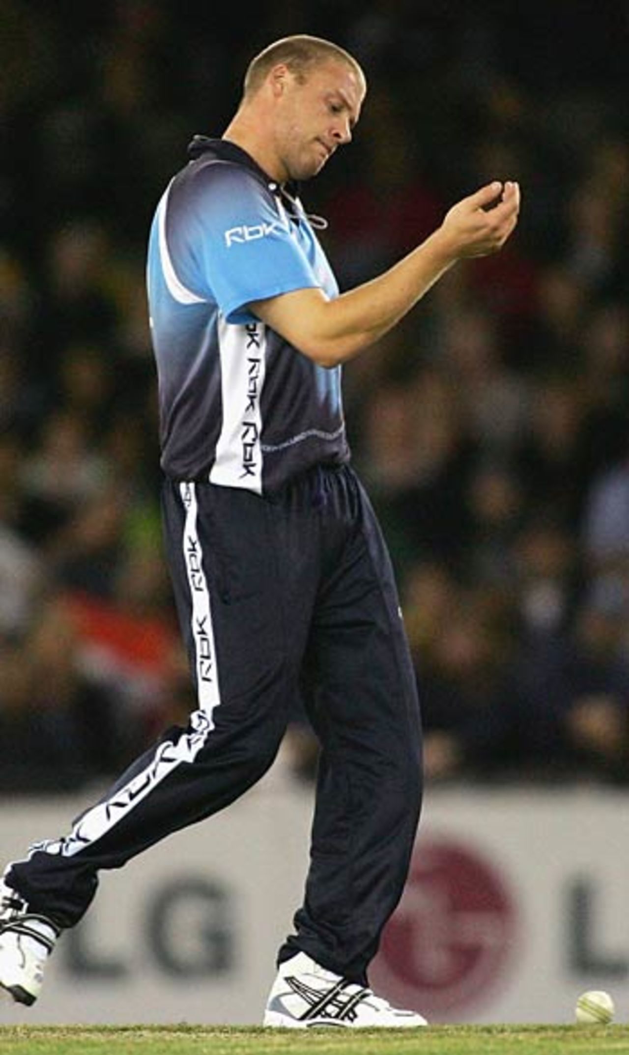 Andrew Flintoff injures his wrist when he  made an unsuccessful attempt to take a catch off Adam Gilchrist, Australia v World XI, Melbourne, October 9, 2005