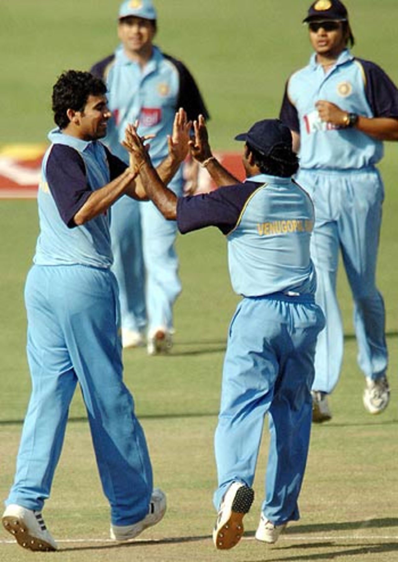 Zaheer Khan celebrates taking a wicket with Venugopal Rao (right) in the final of the Challenger Trophy, Mohali, October 13, 2005