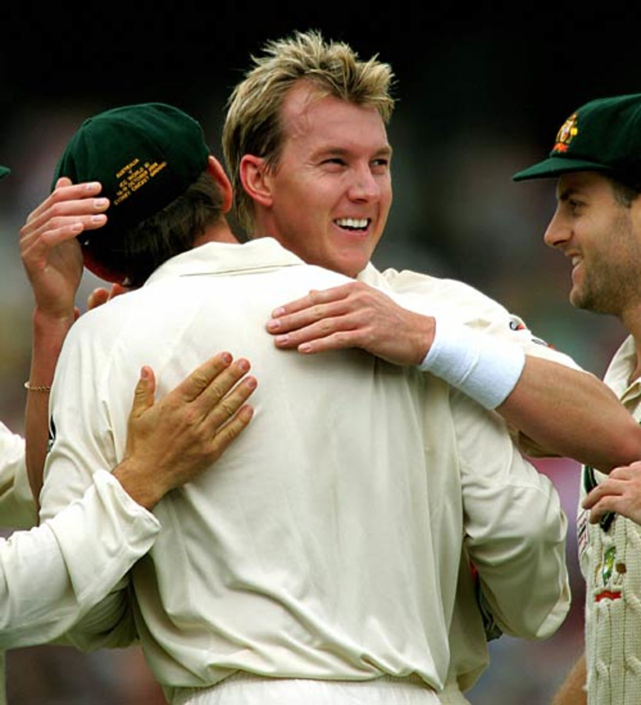 Brett Lee celebrates with Adam Gilchrist after the pair had combined to dismiss Graeme Smith, Australia v World XI, Super Test, 2nd Day, Sydney, October 15, 2005