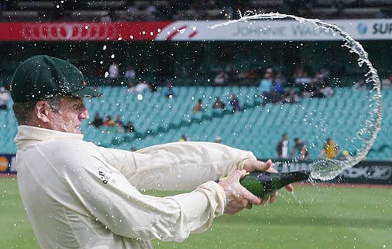 Stuart MacGill turns the champagne as much as his leg breaks, Australia v World XI, Super Test, Sydney, 4th Day, October 17, 2005