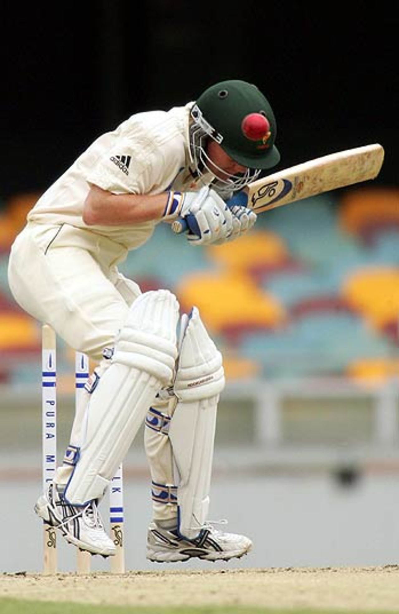 Xavier Doherty evades a bouncer from James Hopes, Queensland v Tasmania, Brisbane, October 17-20, 2005