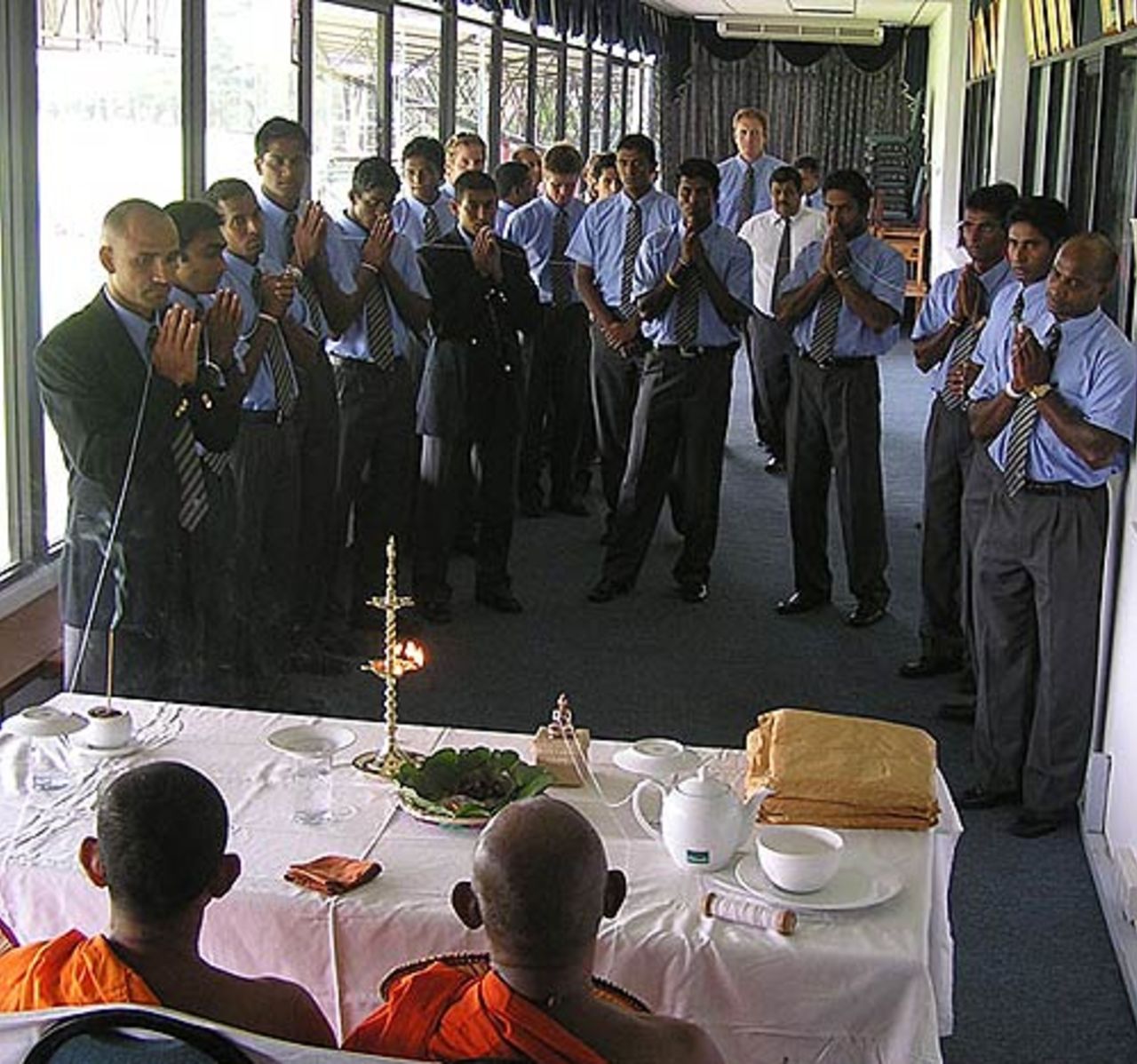 Sri Lankan team pray together on the eve of their departure to India. Colombo, October 20, 2005