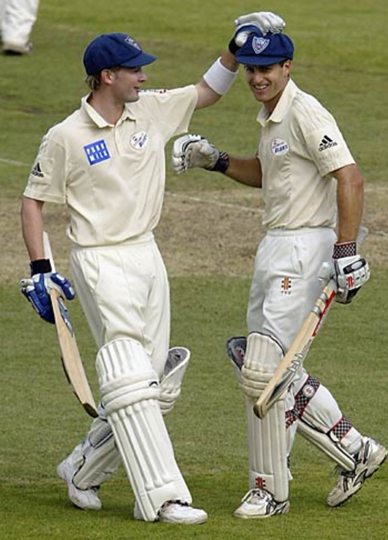 Simon Katich of NSW celebrates his century with team mate Michael Clarke, New South Wales v South Australia, Pura Cup, SCG, Oct 25, 2005