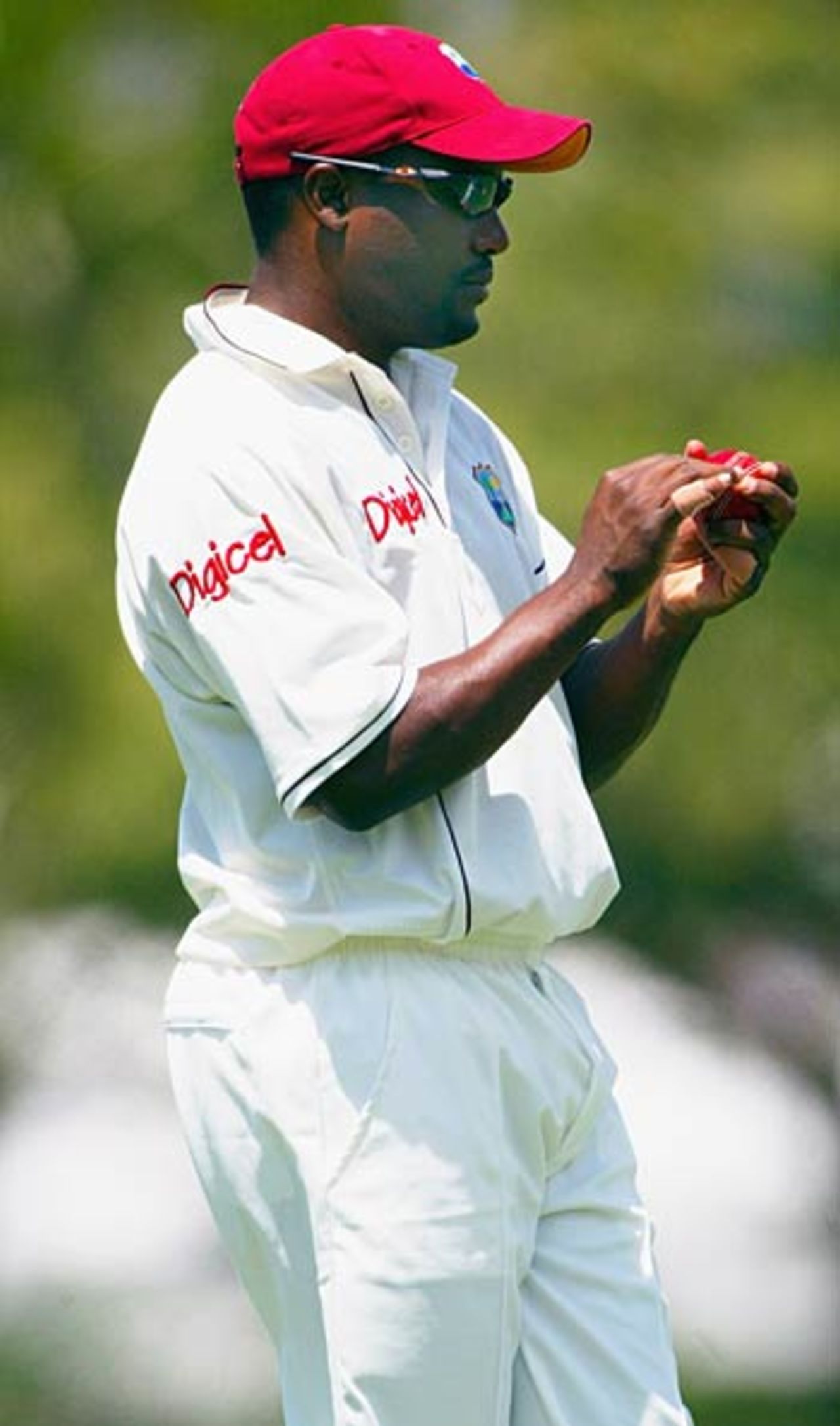 Brian Lara works on the red cherry during the tour game against Queensland, Queensland v West Indians, Alan Border Oval, Brisbane, October 27, 2005
