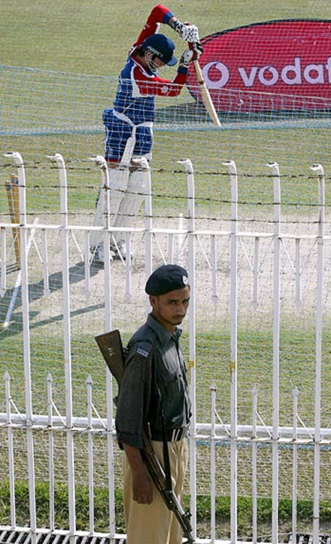 Security personnel watch over England's training session, Islamabad, October 27, 2005