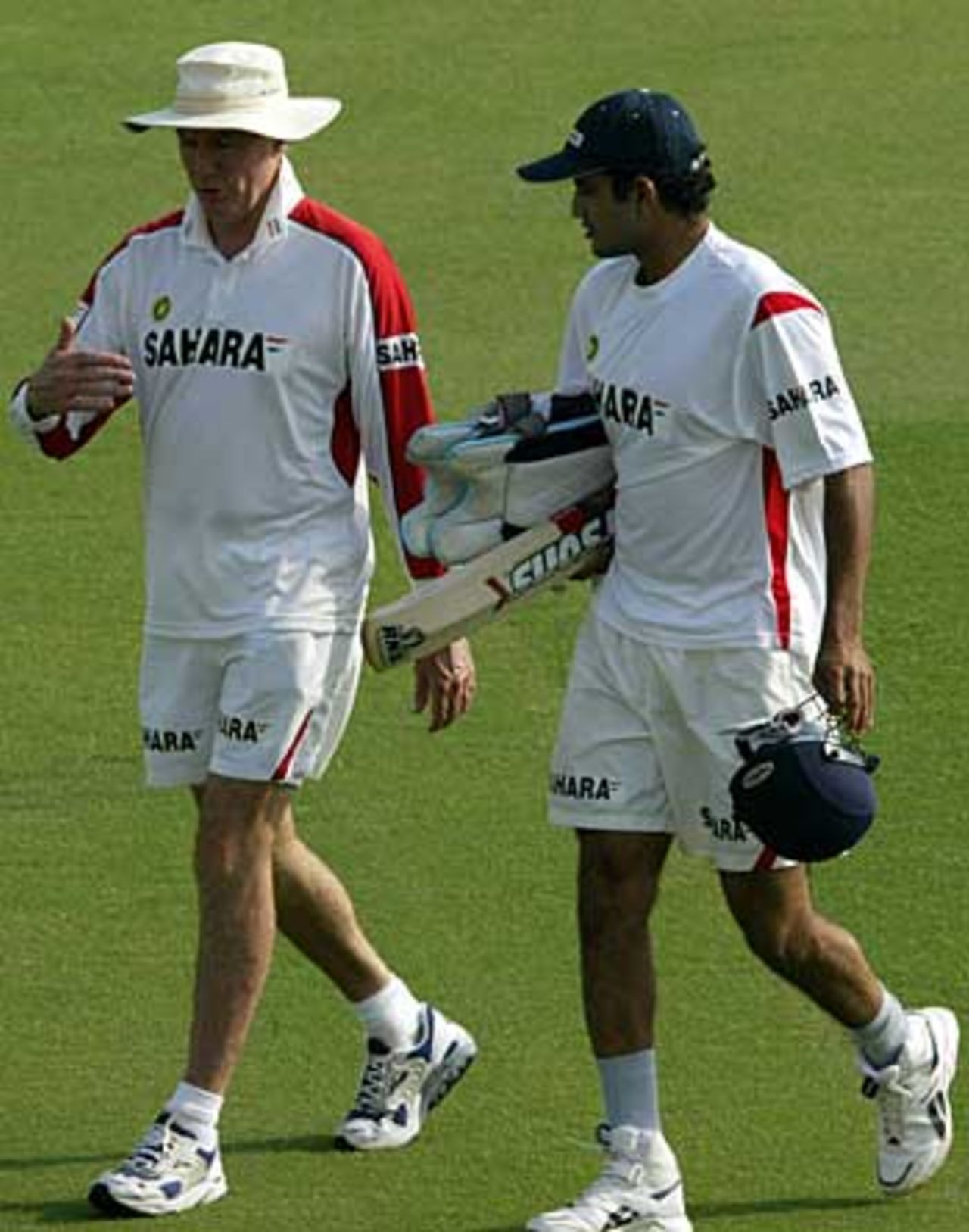 Irfan Pathan talks to Greg Chappell during a practice session, Punjab Cricket Association Ground, Mohali, October 27, 2005