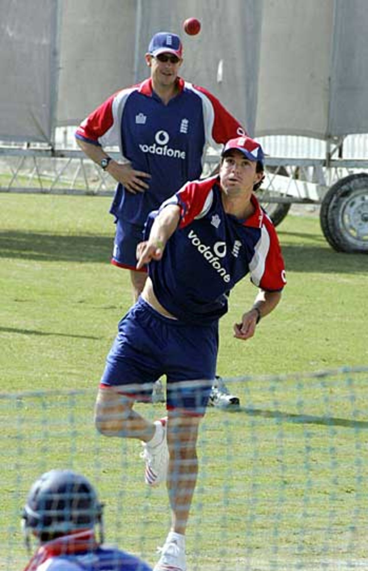 Kevin Pietersen bowls in the nets, watched on by Ashley Giles, Islamabad, October 27, 2005
