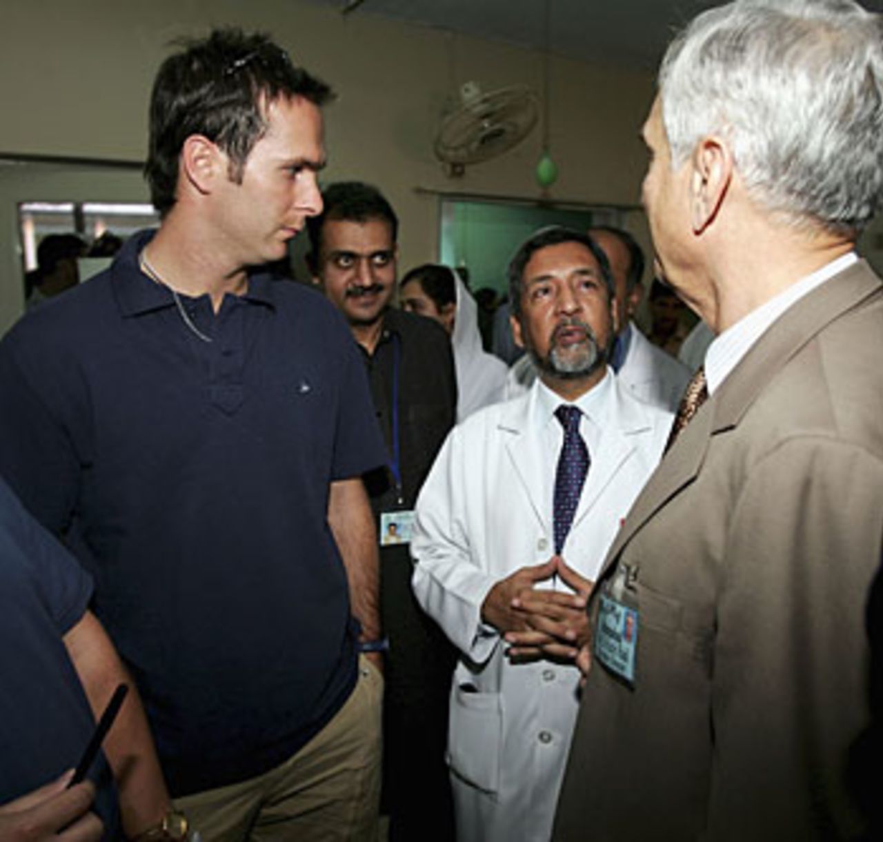 Michael Vaughan chats with doctors at a hospital in Islamabad, October 28, 2005
