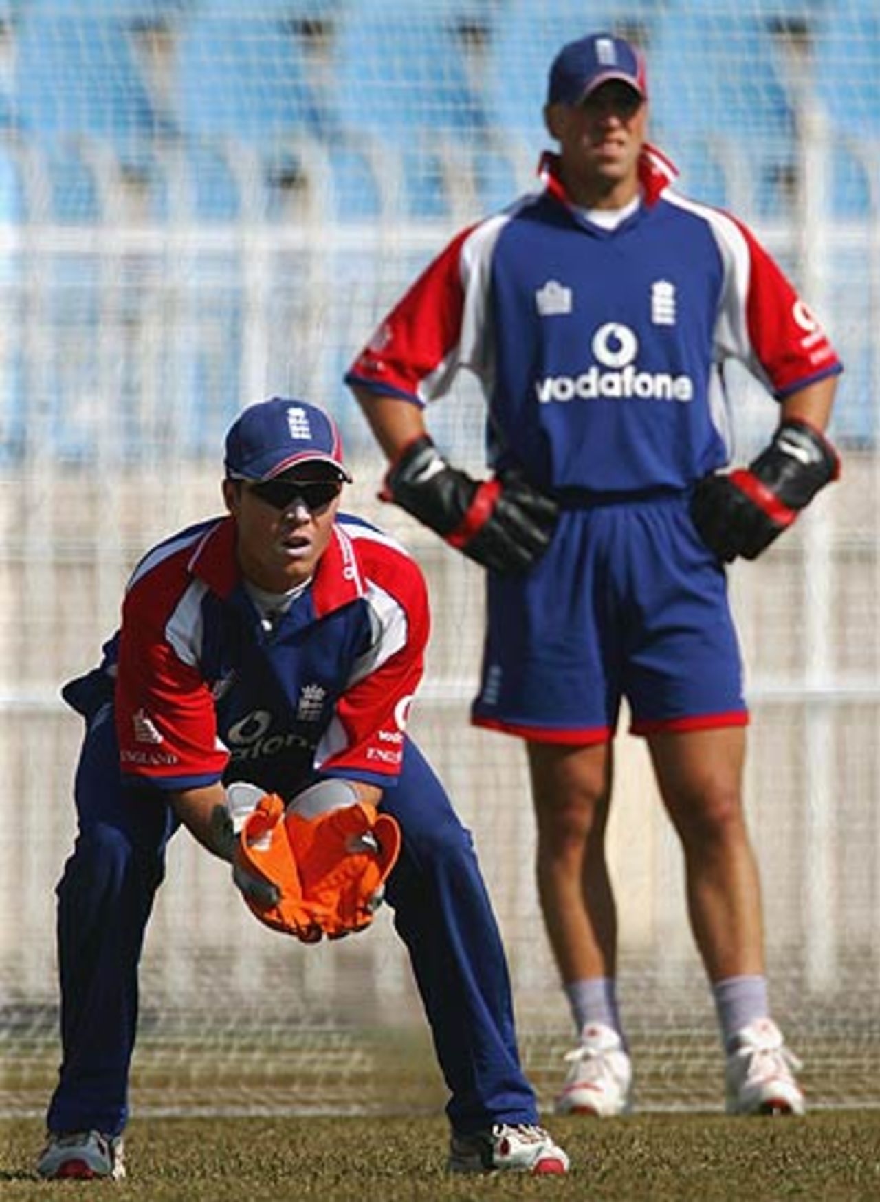 Geraint Jones is watched by Matt Prior at a practice session, Rawalpindi Cricket Stadium, October 29, 2005