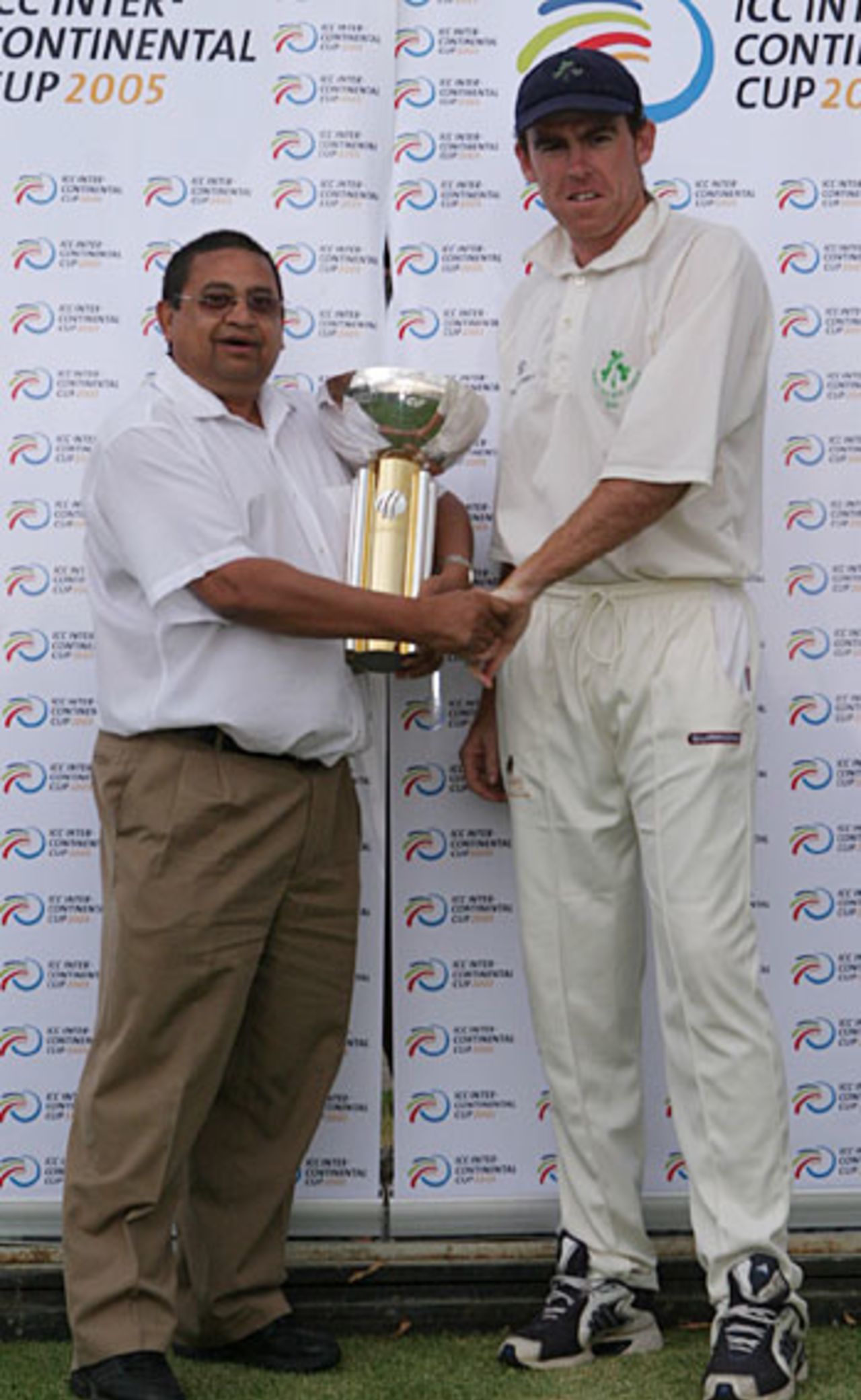 Trent Johnston receives the Intercontinental Cup from Percy Sonn after Ireland's six-wicket win against Kenya, Ireland v Kenya, Intercontinental Cup final, Windhoek, October 29, 2005