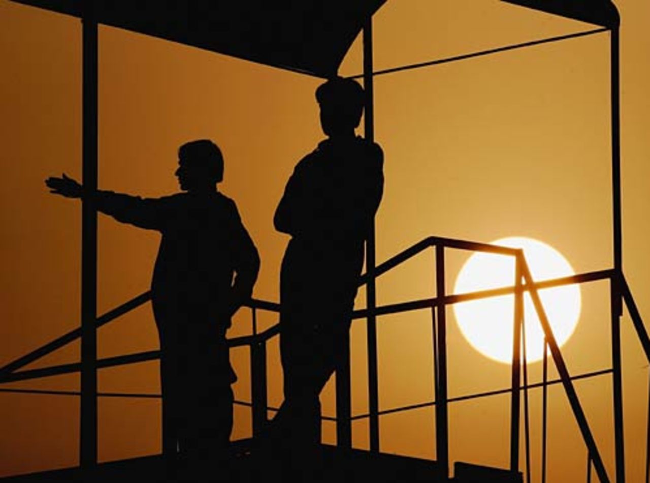 As the sun sets, spectators shelter from the heat , Patron's XI v England XI, Rawalpindi, November 1, 2005