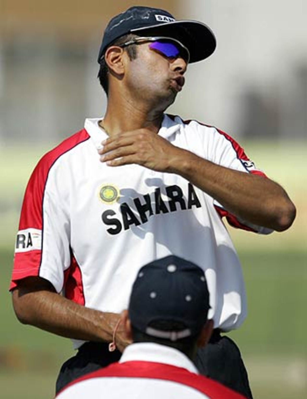 Rahul Dravid describes a cricketing pull shot to teammate Yuvraj Singh during a practice session, Madhavrao Scindia Cricket Ground, Rajkot, November 8, 2005