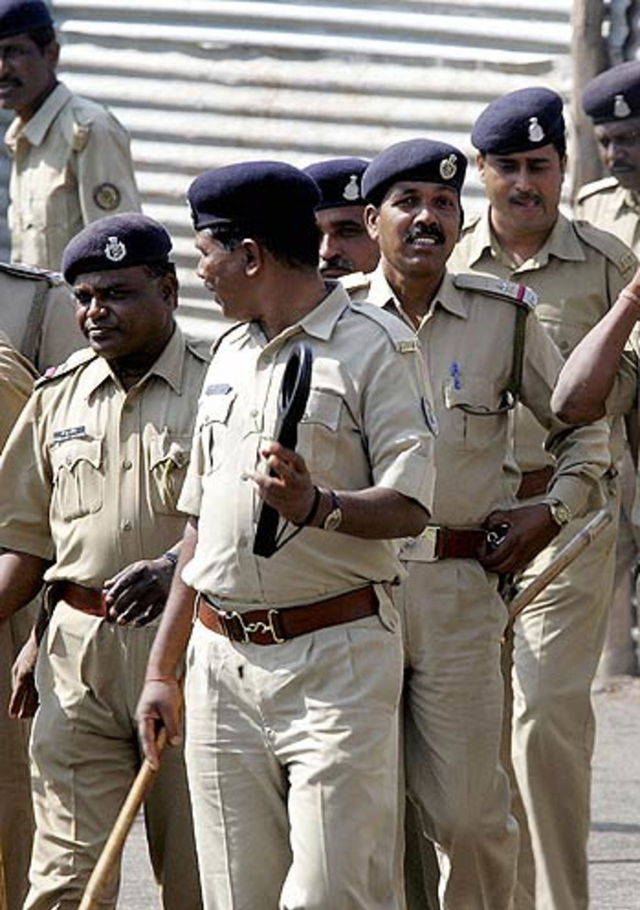 Policemen watch India and Sri Lanka practise, Baroda, November 11, 2005