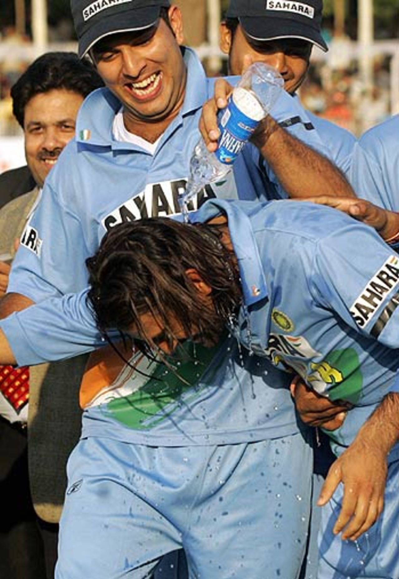 Yuvraj Singh douses Mahendra Singh Dhoni with water to celebrate his Man of the Series announcement, India v Sri Lanka, 7th ODI, Baroda, November 12, 2005
