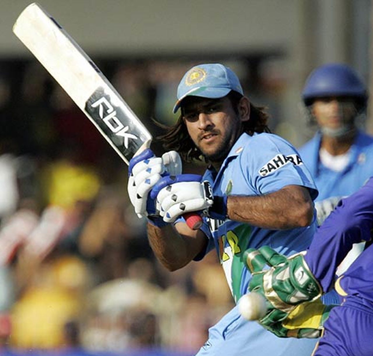 Mahendra Singh Dhoni cracks one his nine boundaries during a belligerent 80 off 73, India v Sri Lanka, 7th ODI, Baroda, November 12, 2005